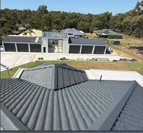 The same roof after restoration: cleaned, re-pointed and coated in charcoal membrane.